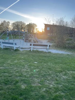A bench by a playground — bench in Sola, Norway